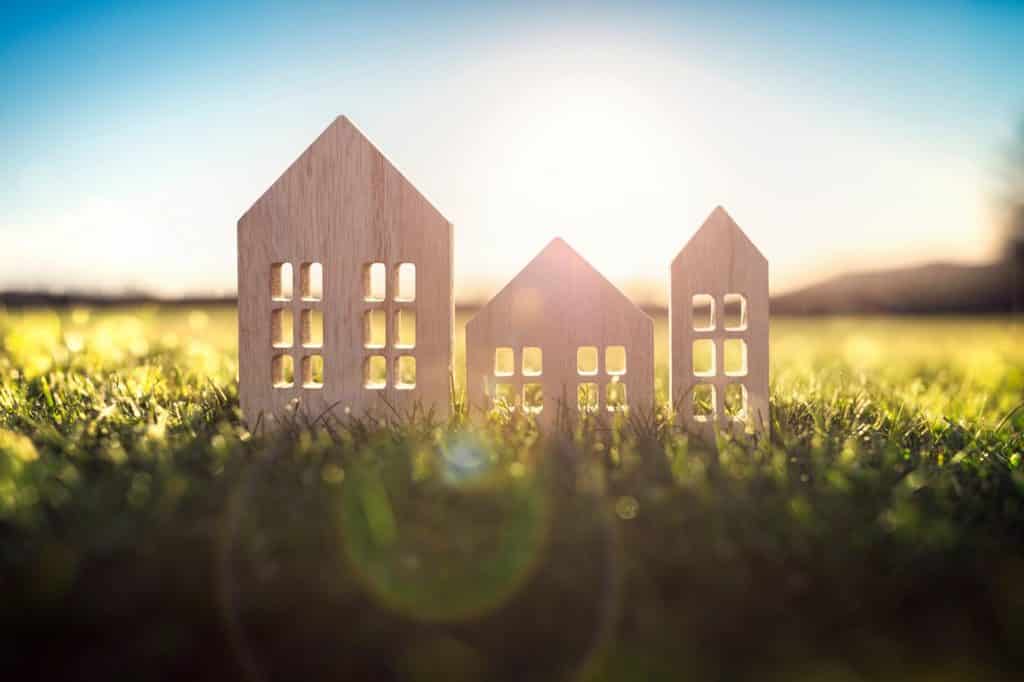 Small wooden houses nestled in lush green grass | Sewell Sewell Beard LLC