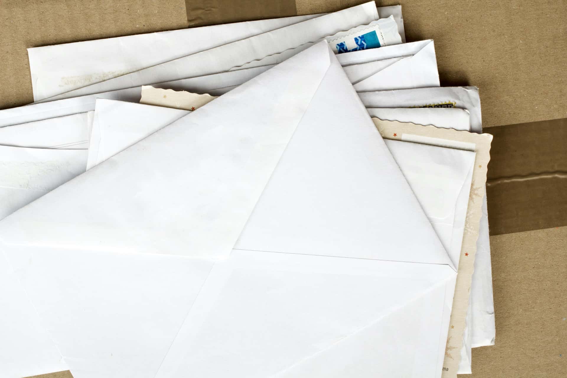 A stack of aged envelopes and letters