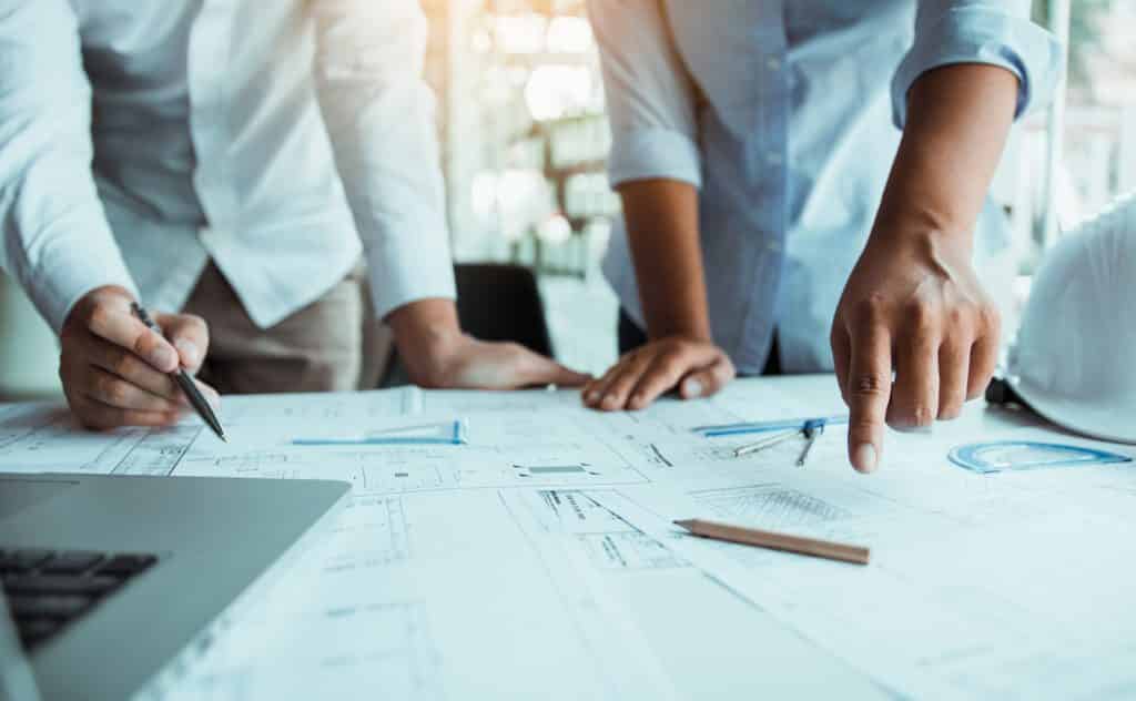 Business team members focused on a project | Sewell Sewell Beard LLC
