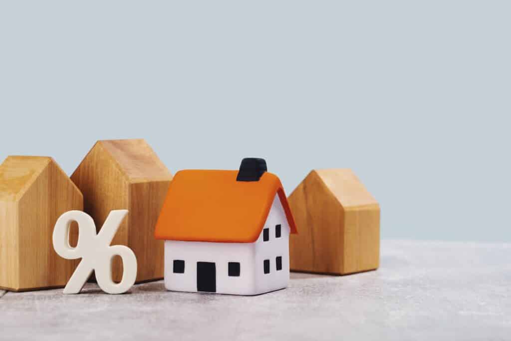 Wooden block houses and a percentage sign
